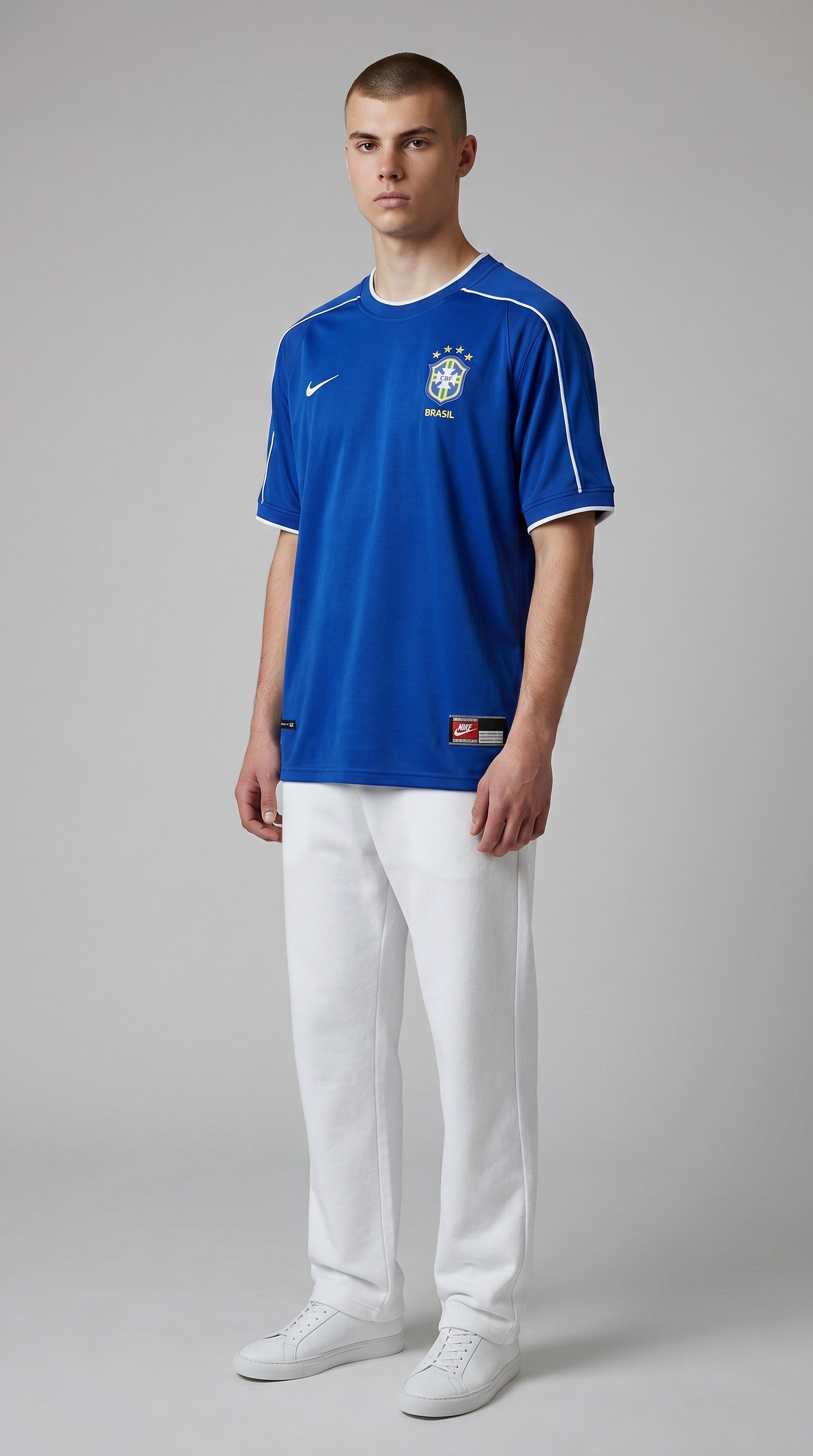 Model wearing My Store 8 blue Brasil 1998 away soccer jersey with white trim and team crest on a grey background.
