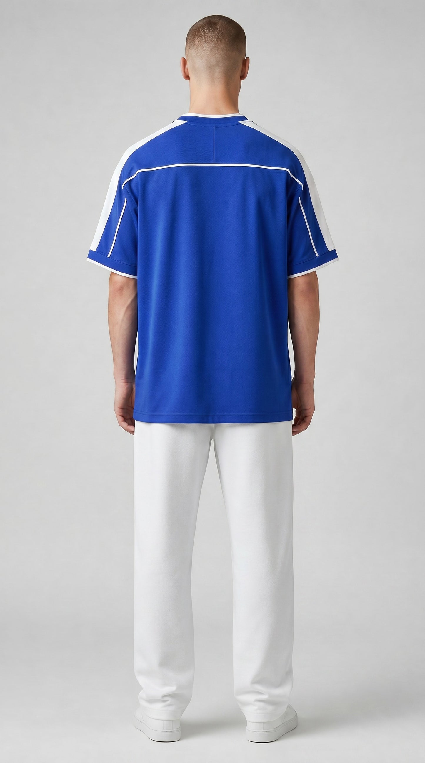 My Store 8 blue and white 1998 Brazil away soccer jersey worn by a man with white pants, back view.