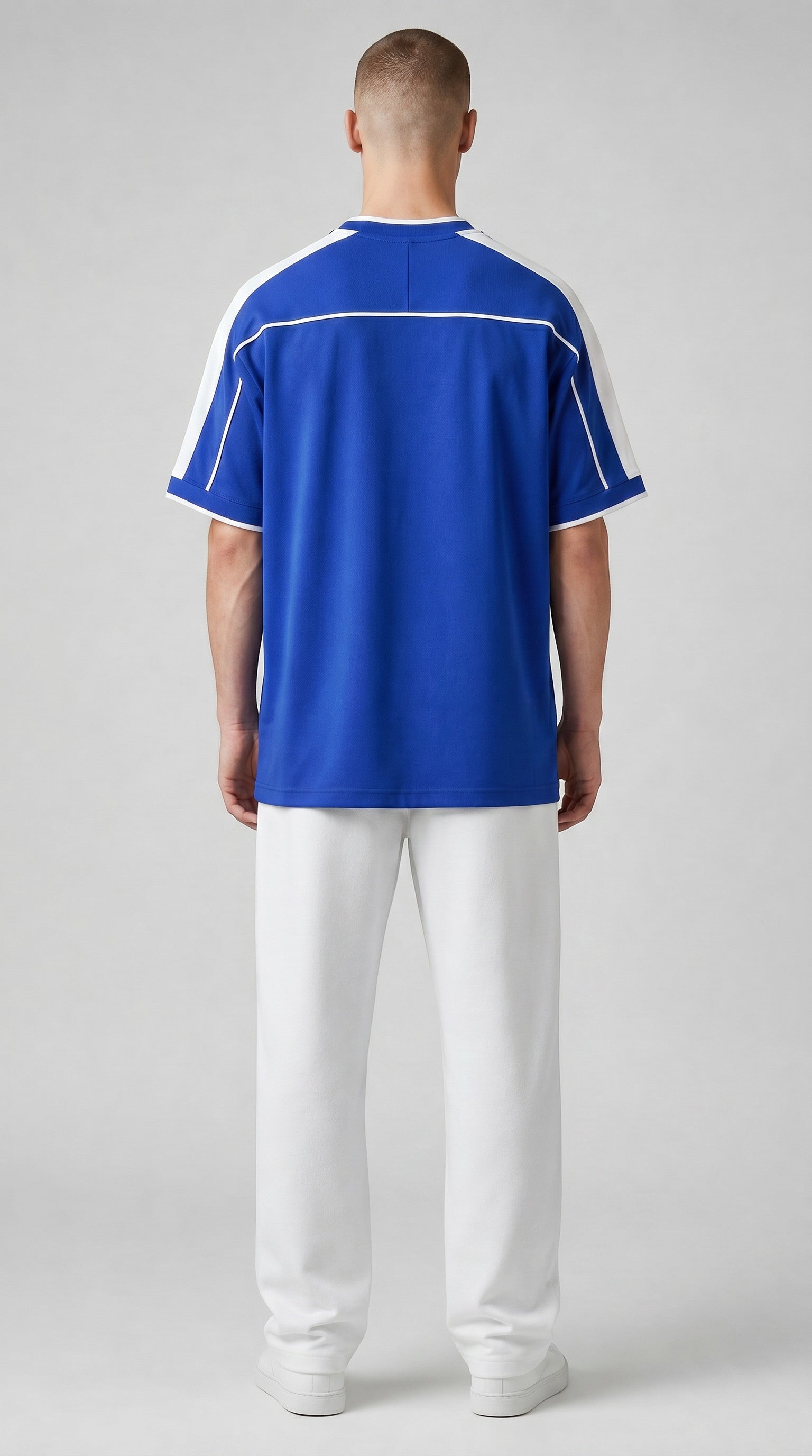 My Store 8 blue and white 1998 Brazil away soccer jersey worn by a man with white pants, back view.