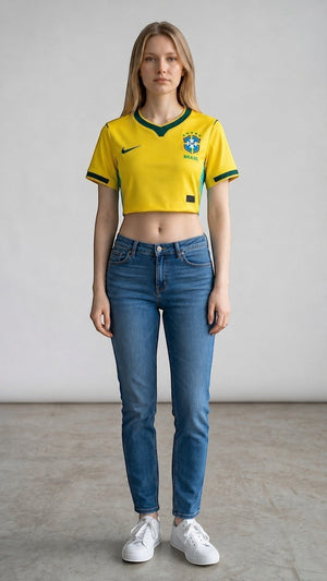 My Store 8 yellow Brasil 2026 women's crop top jersey with green trim, worn by a model with blue jeans.