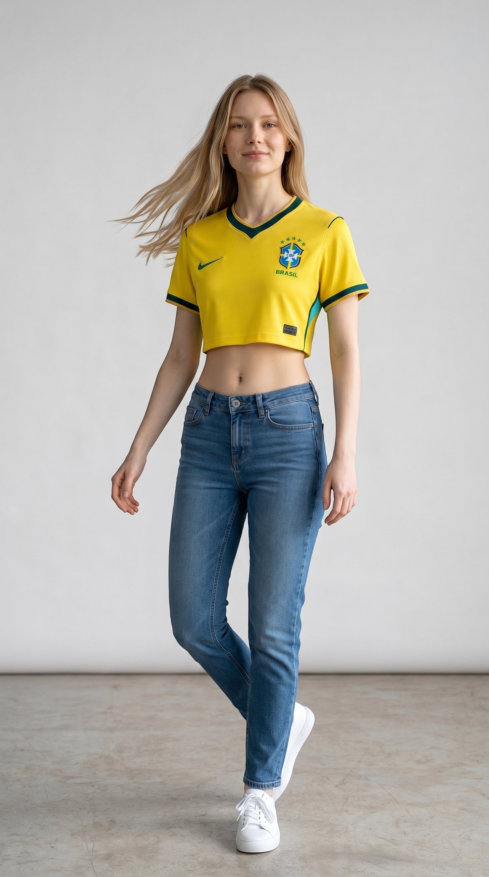 My Store 8 yellow Brazil 2026 women's crop top jersey with green trim worn by a model with blue jeans