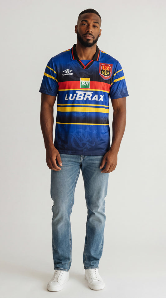 Model wearing My Store 8 Flamengo 1995 blue alternate soccer jersey with yellow and red stripes and sponsor logos